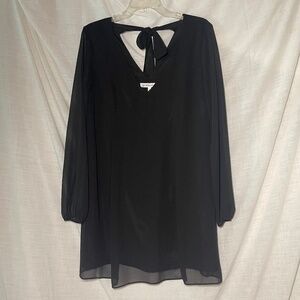 BCBGenerations Women’s Black Blouse. V neck front and back. Tie. Sheer sleeves.